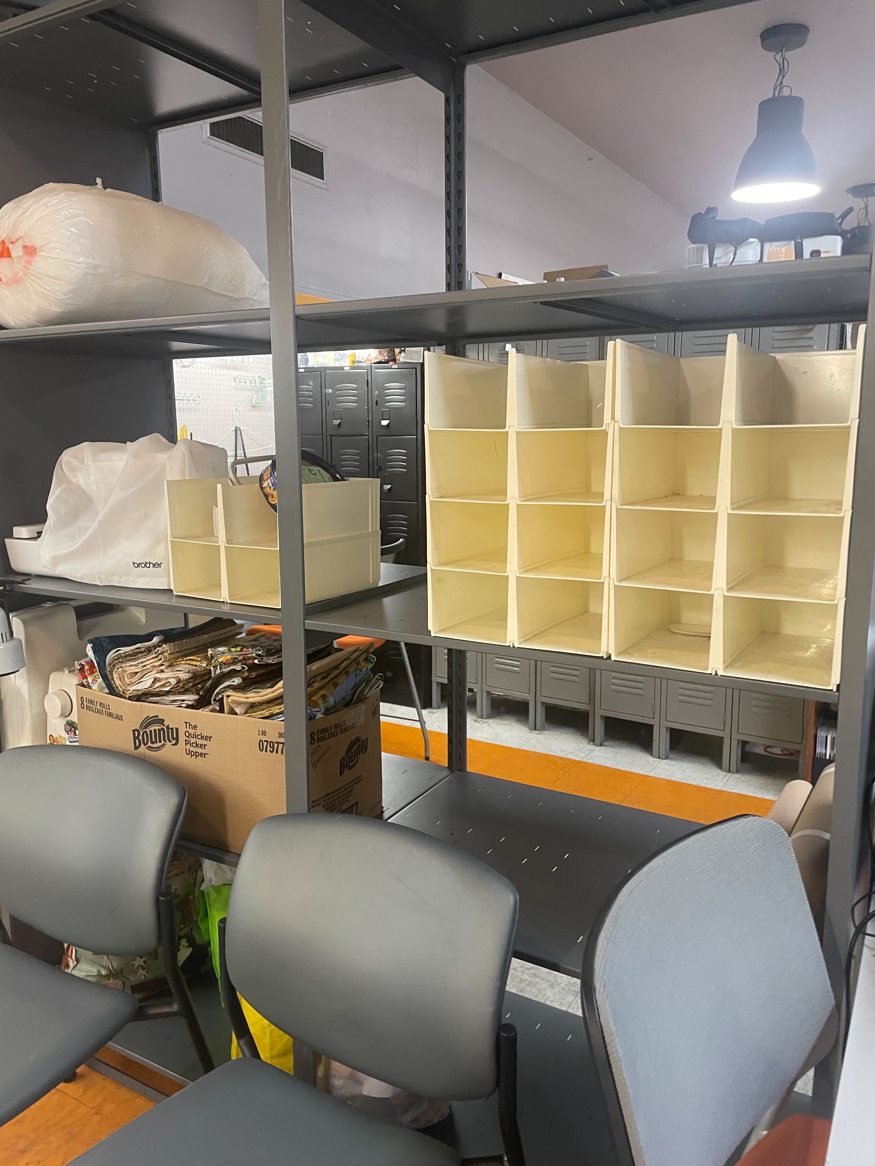 White cubbies on the sewing and jewelry shelves